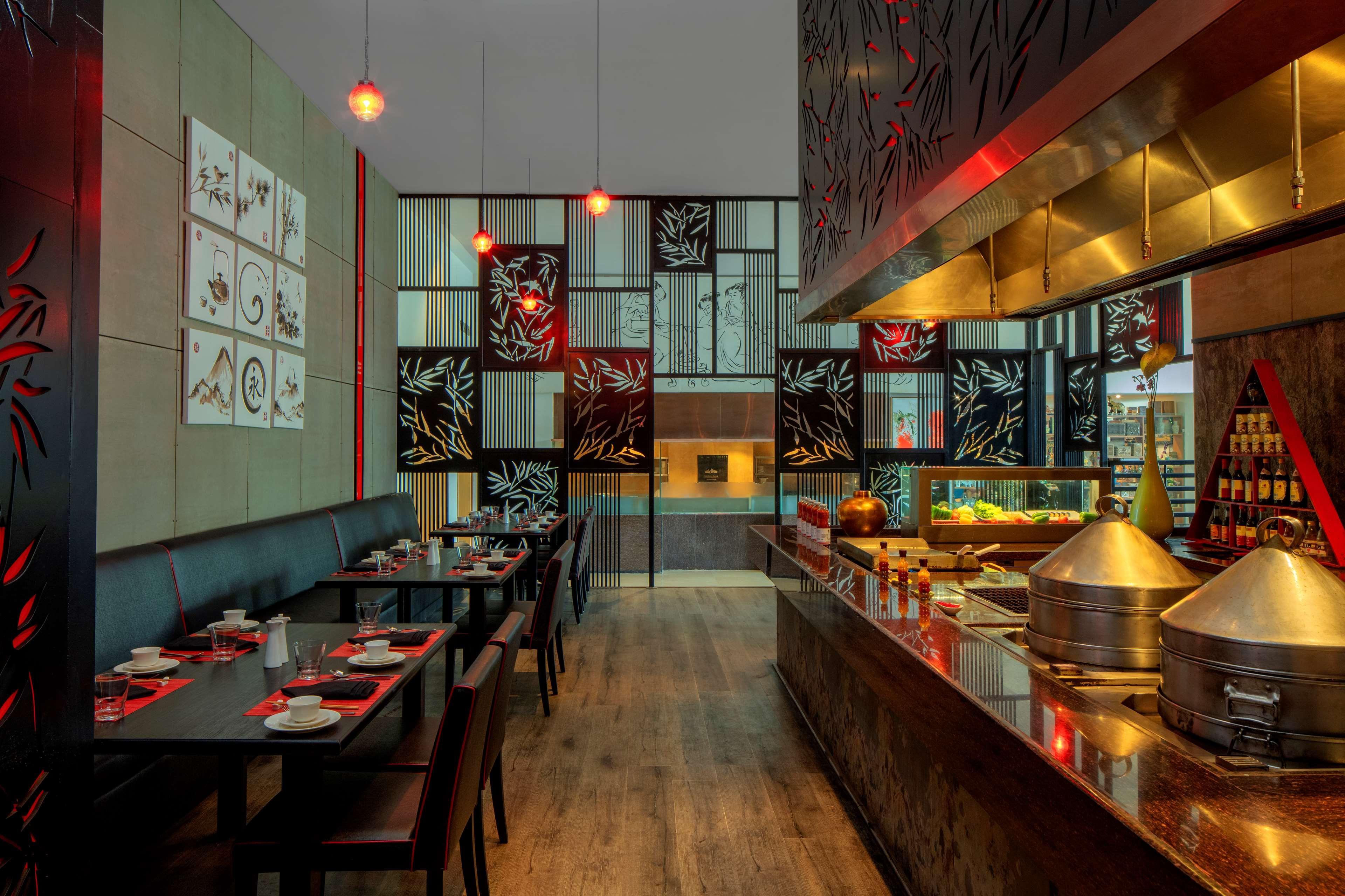 Radisson Blu Plaza Hotel Hyderabad Banjara Hills Bagian luar foto The interior of a restaurant in the United Arab Emirates